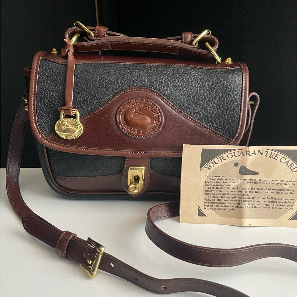 Dooney and Bourke Awl leather vintage carrier Mini Crossbody Bag